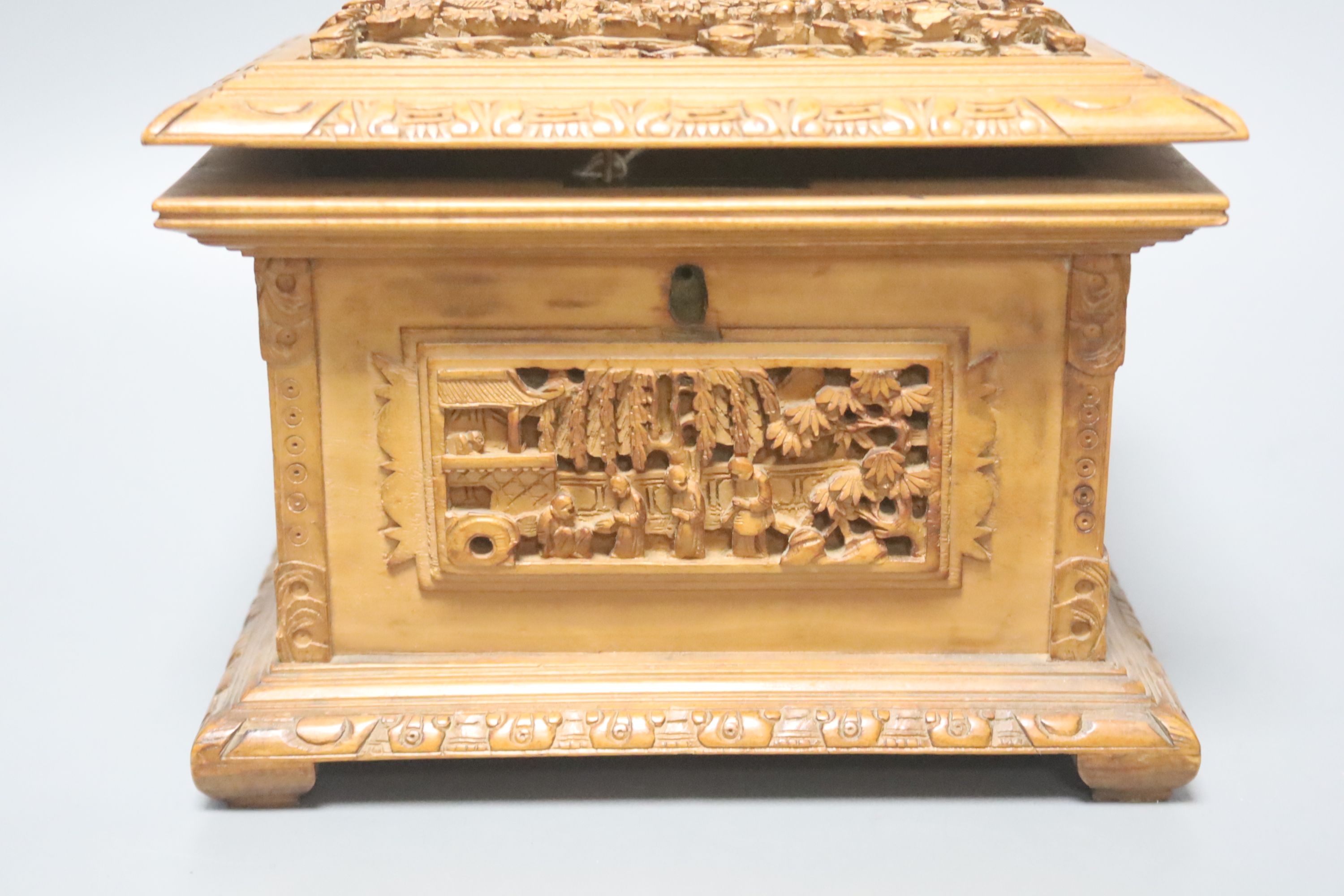 Three 19th century Chinese carved sandalwood caskets, longest 19cm